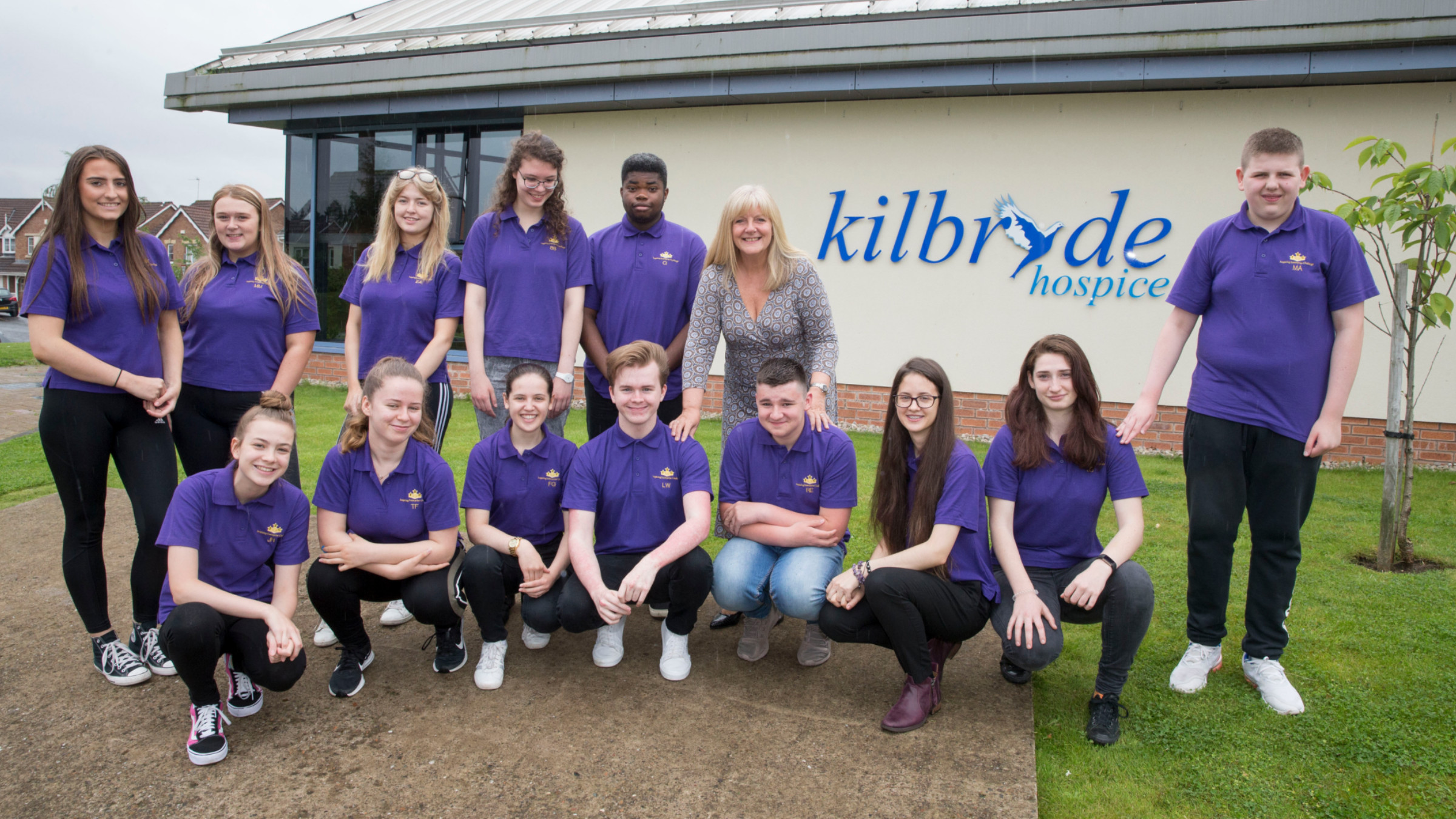 Anne Clyde UKSE with young entrepreneurs outside Kilbryde hospice