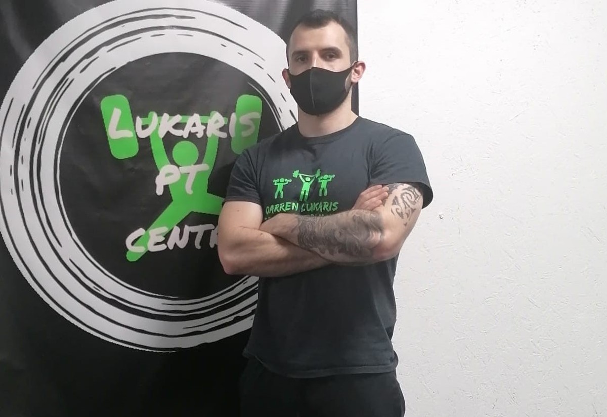 Personal Trainer, Darren Lukaris wearing merch from his business 'Lukaris PT Centre'