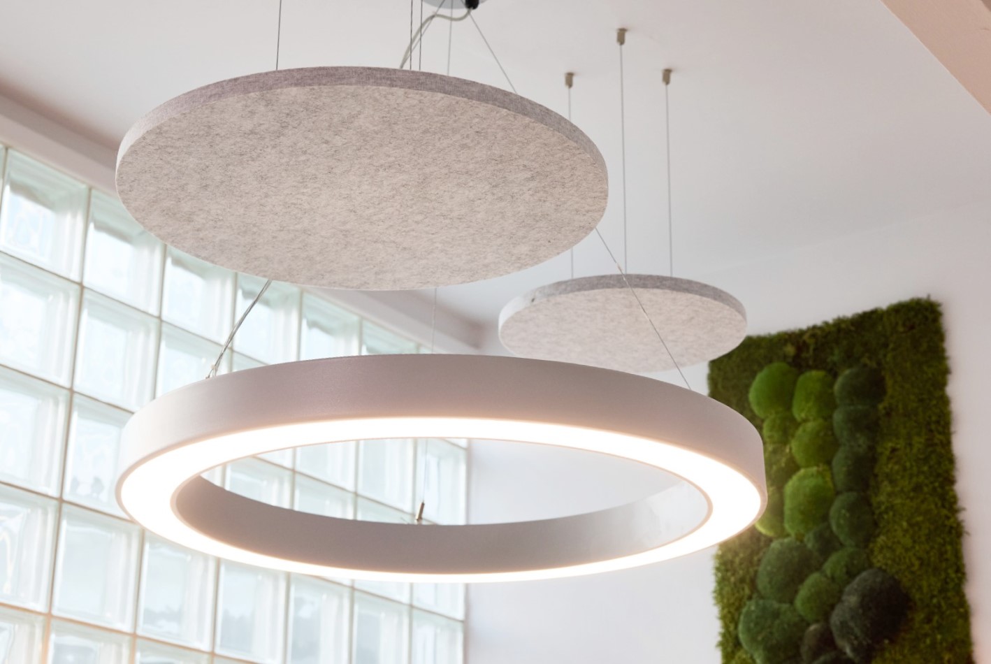 Modern lights and artificial green wall inside UKSE's office space to rent in Sheffield