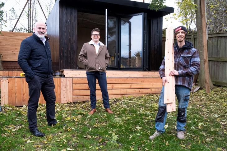 Three of Conker Construction's employees in front of their eco-studios which benefited from UKSE's business start-up grant